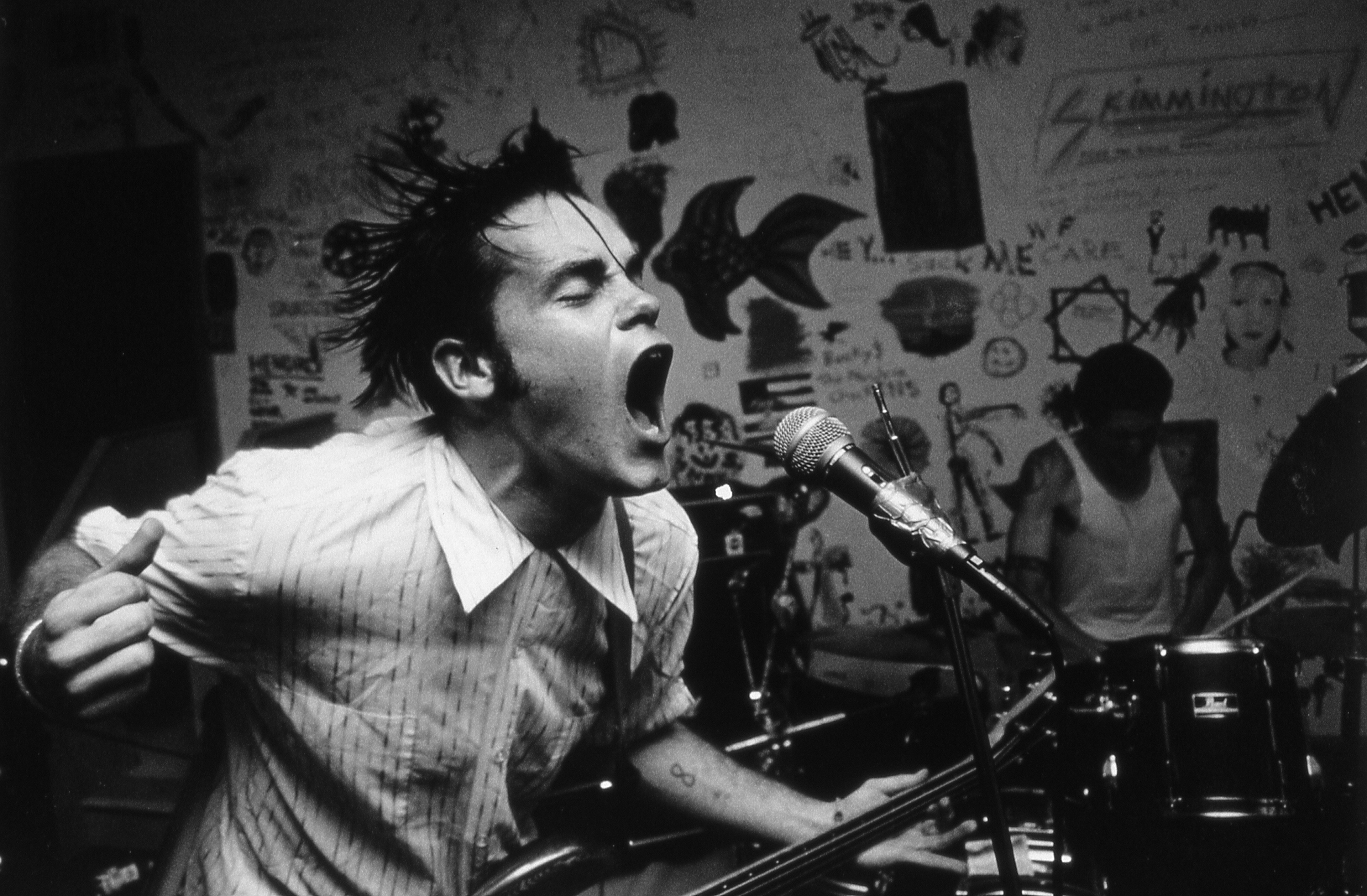 Black and white photograph of a punk performance